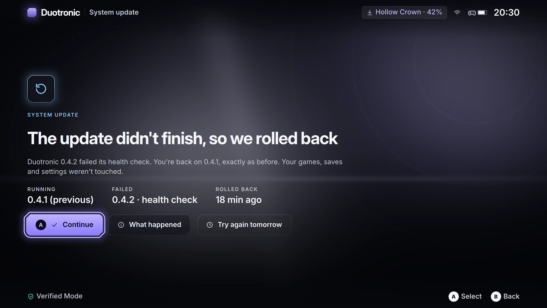 A calm recovery screen explaining that an update didn't finish and the system went back to the previous version, with a lit Continue button.